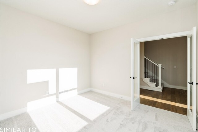 unfurnished room with wood-type flooring