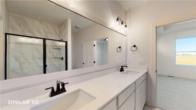 bathroom with vanity and an enclosed shower