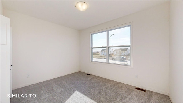 view of carpeted spare room