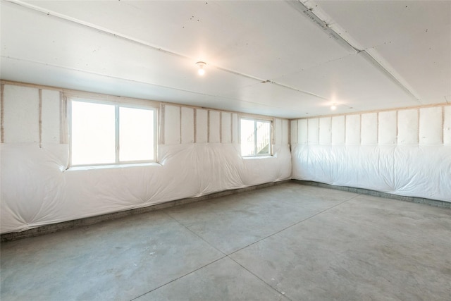 spare room featuring concrete flooring