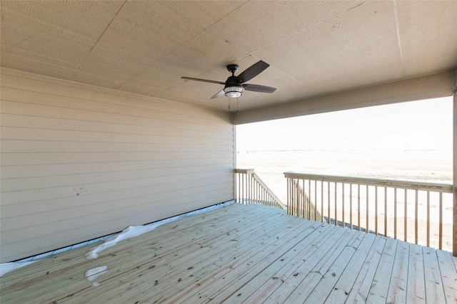 wooden deck featuring ceiling fan