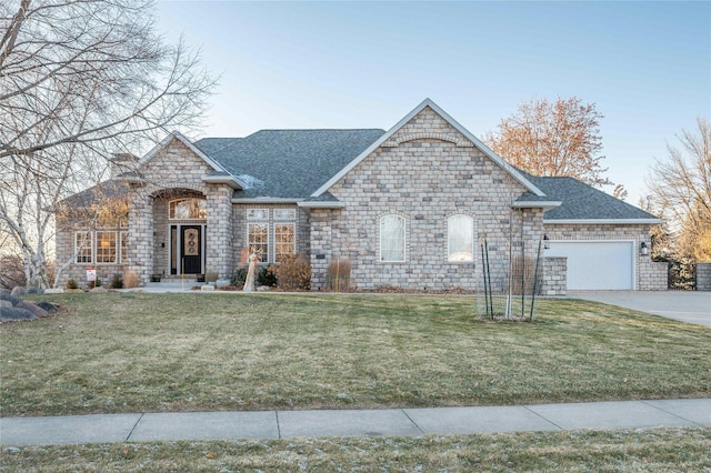 view of front facade with a front lawn and a garage