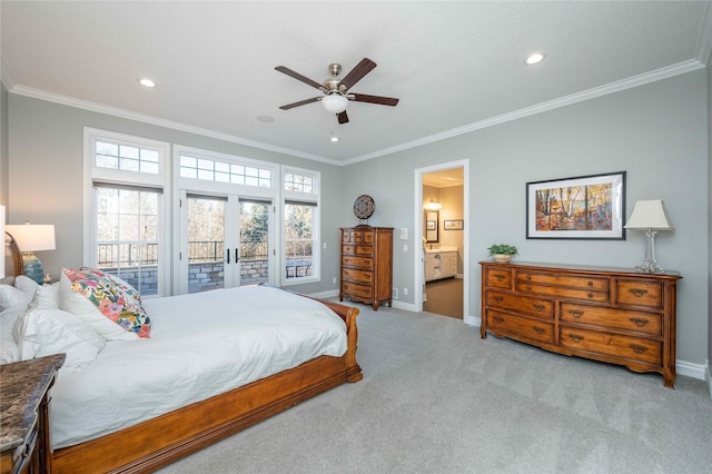 carpeted bedroom with access to exterior, connected bathroom, ceiling fan, and ornamental molding