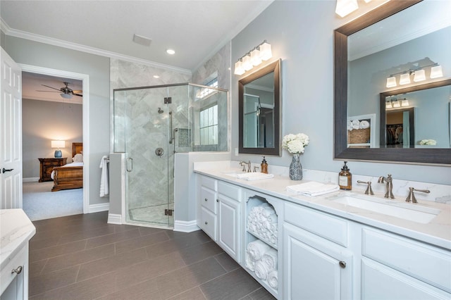 bathroom with vanity, tile patterned floors, ceiling fan, ornamental molding, and an enclosed shower