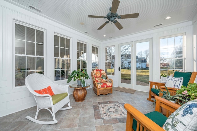 sunroom with ceiling fan