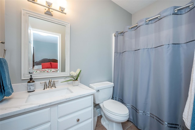 bathroom with tile patterned flooring, vanity, toilet, and a shower with shower curtain