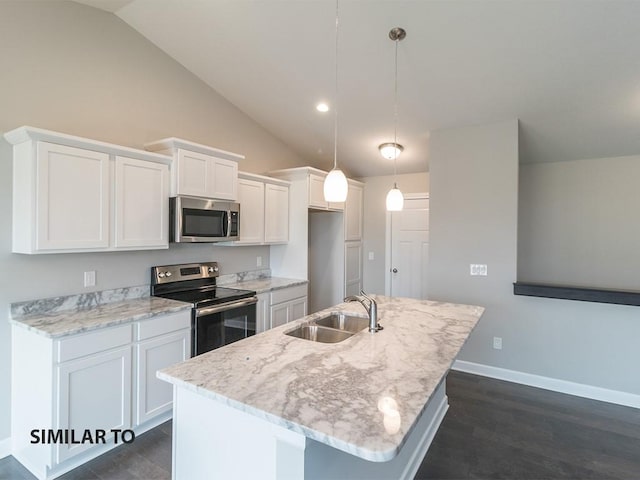 kitchen featuring white cabinets, appliances with stainless steel finishes, hanging light fixtures, and a kitchen island with sink