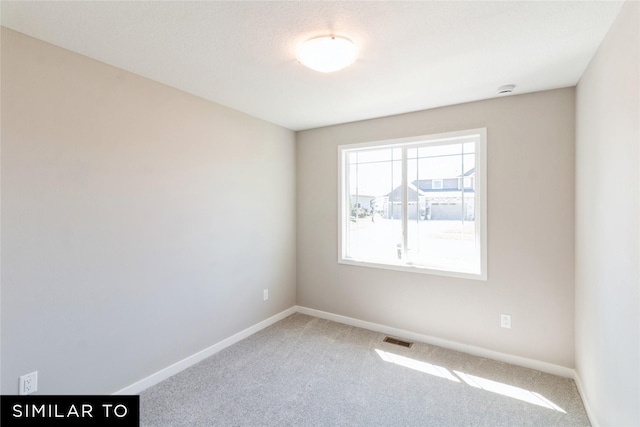 view of carpeted spare room