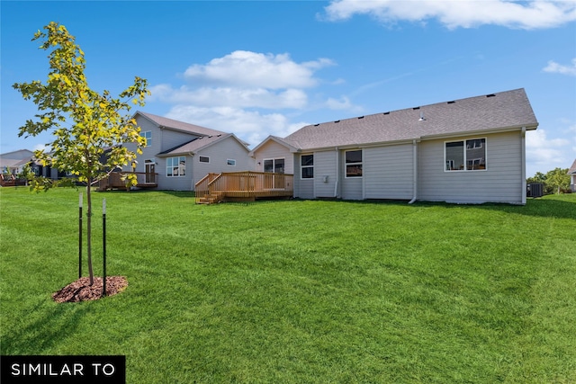 back of house with cooling unit, a lawn, and a wooden deck