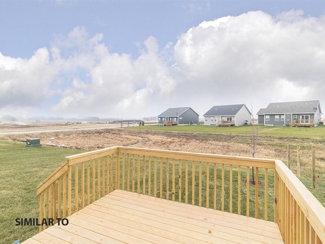 wooden terrace with a yard