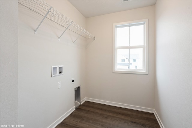 clothes washing area with baseboards, hookup for a washing machine, laundry area, electric dryer hookup, and dark wood-style floors