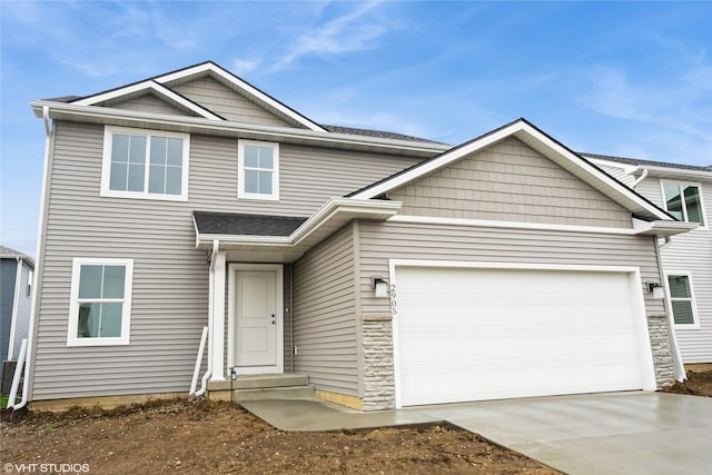 view of front facade with a garage, entry steps, and concrete driveway