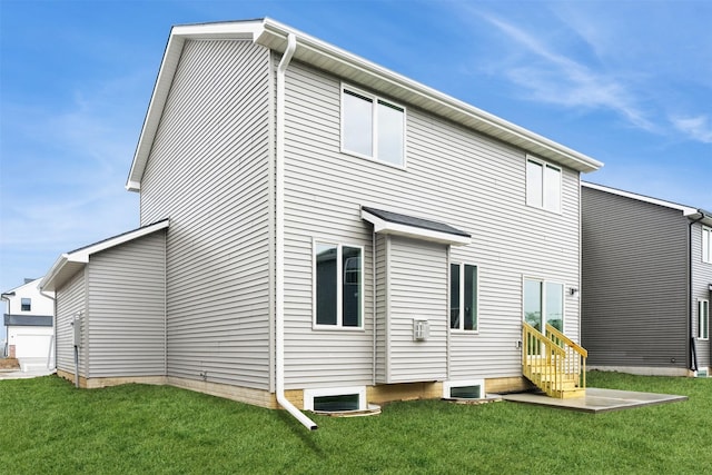 2905 Yordi Dr, Norwalk, IA 50211 - rear view of house with a yard and entry steps