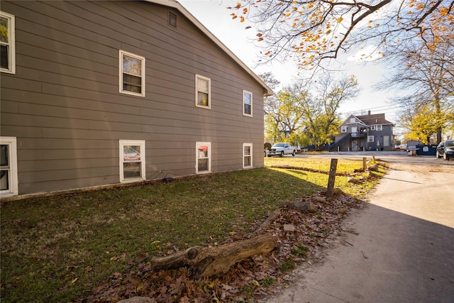 view of home's exterior featuring a yard