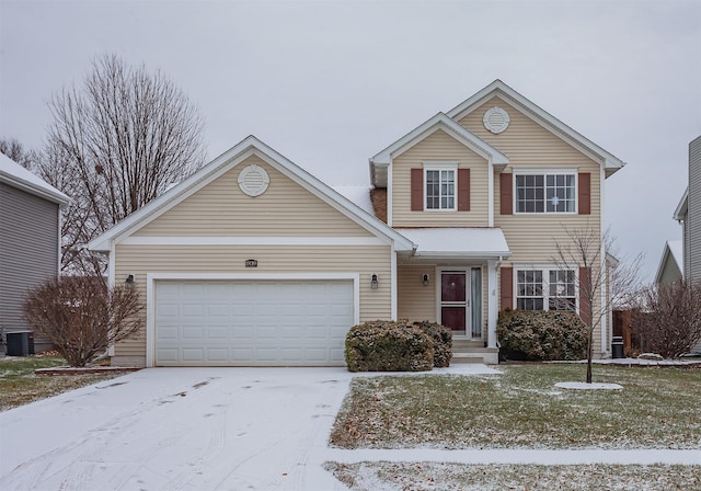 view of property with a garage and central AC