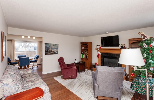 living room featuring hardwood / wood-style flooring and a textured ceiling