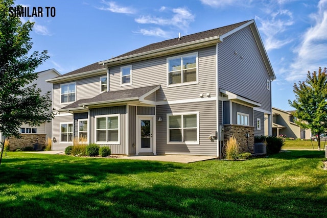 back of house featuring a lawn, central air condition unit, and a patio