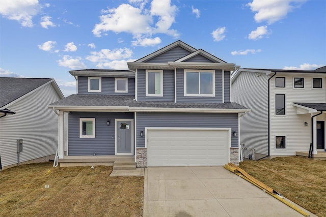 1745 Willow Ct, Norwalk, IA 50211 - view of front of property featuring concrete driveway, a front lawn, an attached garage, stone siding, and a shingled roof
