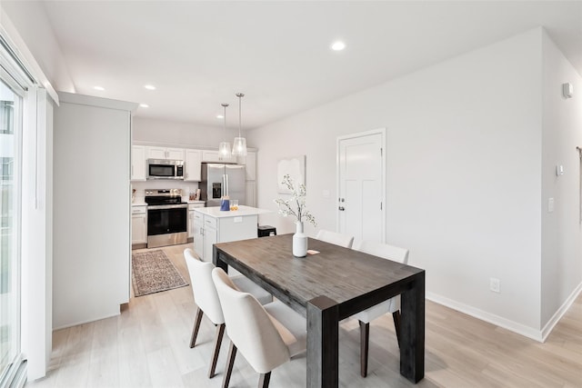 dining area featuring light hardwood / wood-style flooring