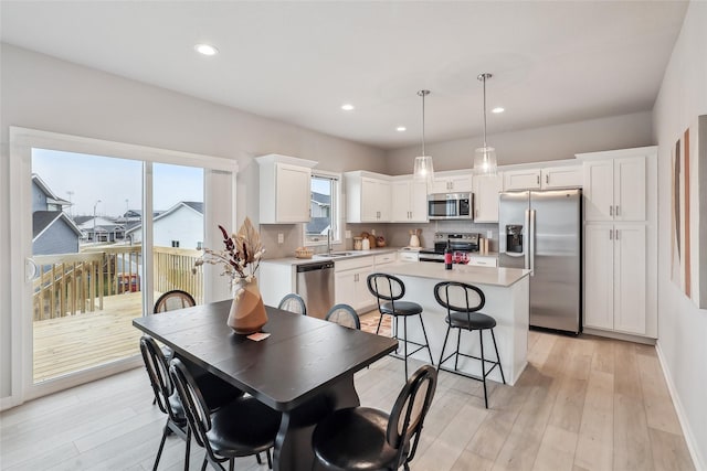 1727 Willow Ct, Norwalk, IA 50211 - dining area with light wood-type flooring and recessed lighting