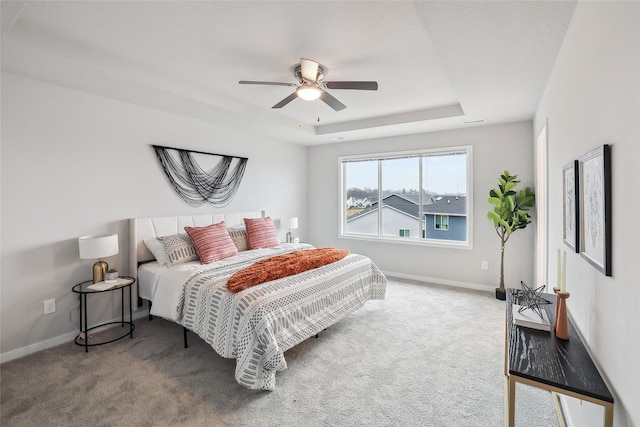 1727 Willow Ct, Norwalk, IA 50211 - carpeted bedroom featuring a raised ceiling and ceiling fan