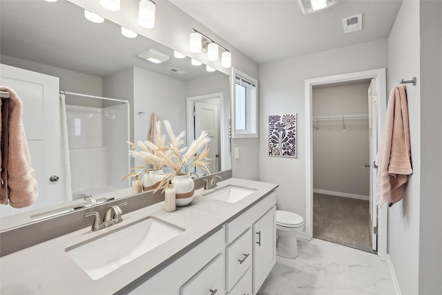1727 Willow Ct, Norwalk, IA 50211 - full bath with marble look tiles, double vanity, and a walk in closet