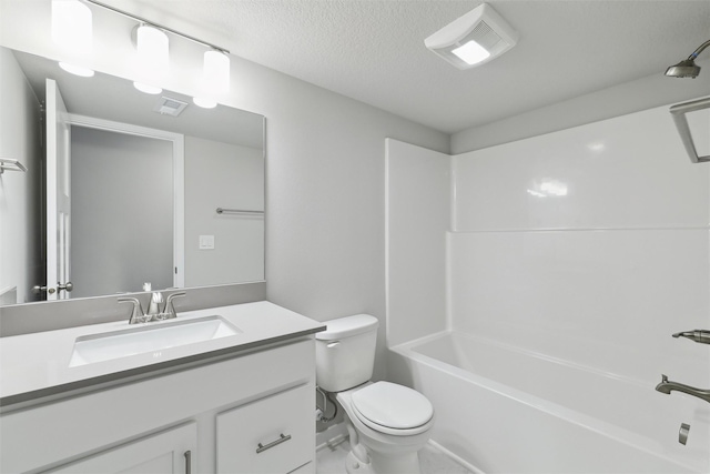 full bathroom featuring vanity, shower / bath combination, a textured ceiling, and toilet