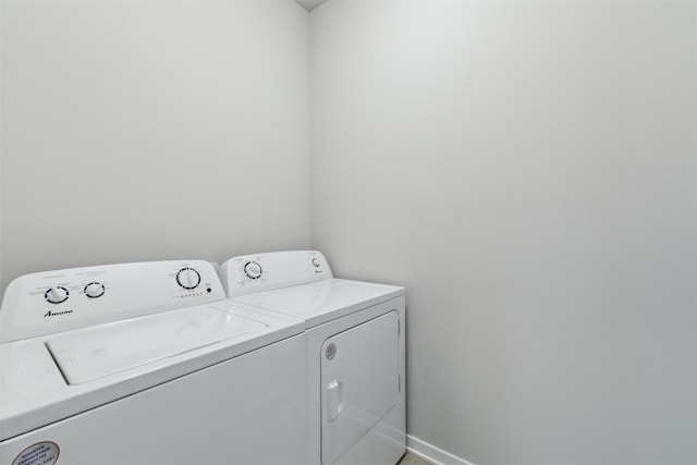 clothes washing area featuring separate washer and dryer