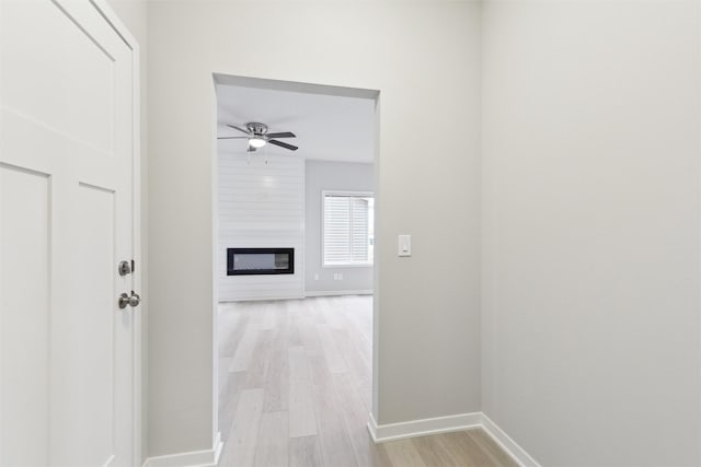 hall with light wood-type flooring