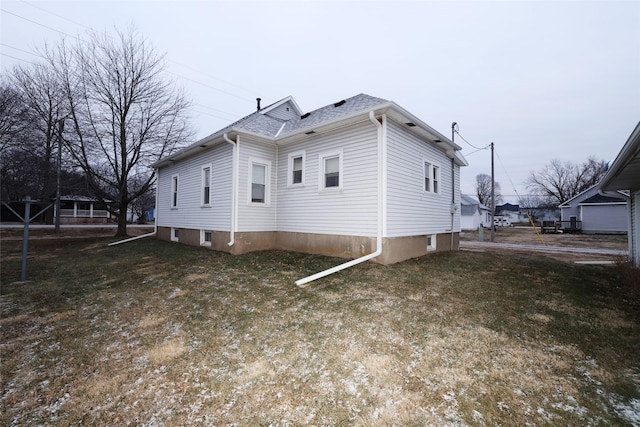 view of property exterior featuring a yard