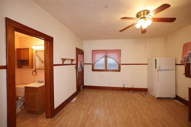 interior space featuring ceiling fan and light hardwood / wood-style flooring