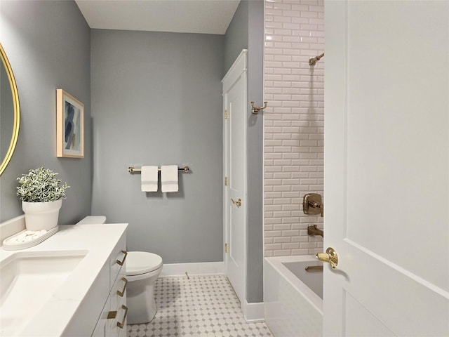 full bathroom featuring vanity, toilet, and tiled shower / bath combo