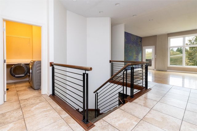 hall with tile patterned floors