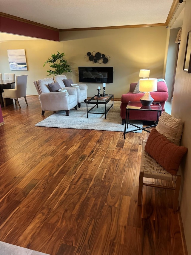 living room featuring ornamental molding and hardwood / wood-style floors