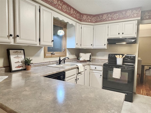 kitchen featuring white cabinetry, sink, black appliances, and a textured ceiling