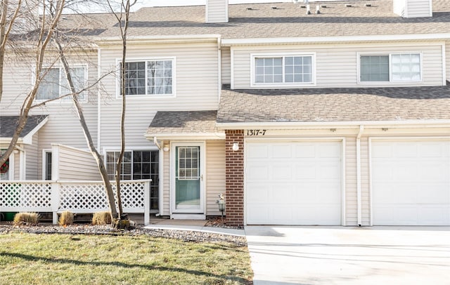 multi unit property featuring a garage