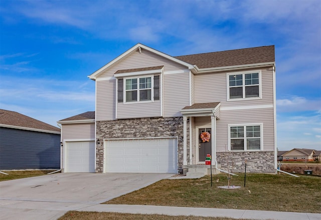 view of front of house featuring a front yard and a garage