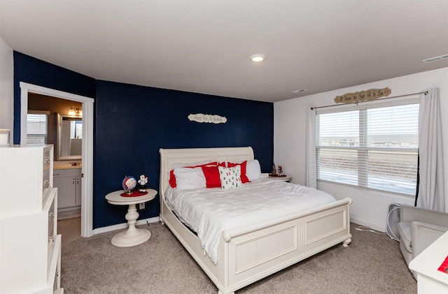 carpeted bedroom with ensuite bathroom