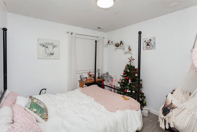 bedroom featuring dark hardwood / wood-style flooring