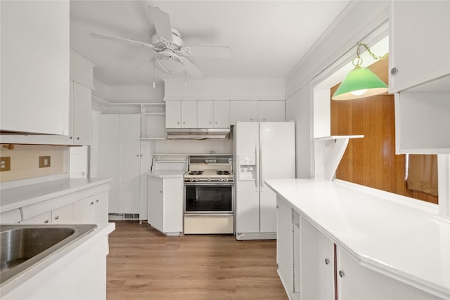 kitchen with white cabinetry, light hardwood / wood-style flooring, ceiling fan, and white appliances