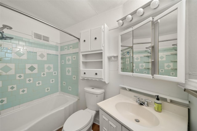 full bathroom with vanity, toilet, and tiled shower / bath combo