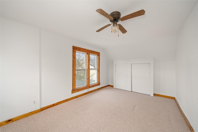 bonus room featuring ceiling fan, light carpet, and vaulted ceiling