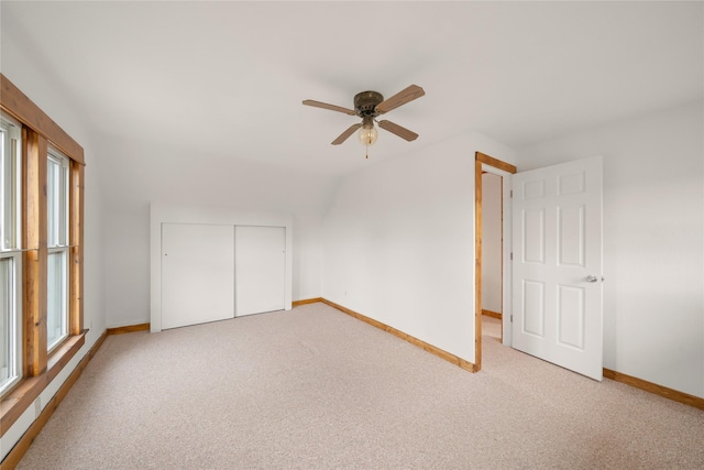 bonus room featuring ceiling fan, carpet floors, and a healthy amount of sunlight