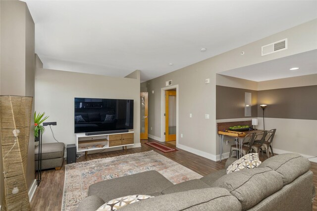 living room featuring dark hardwood / wood-style flooring