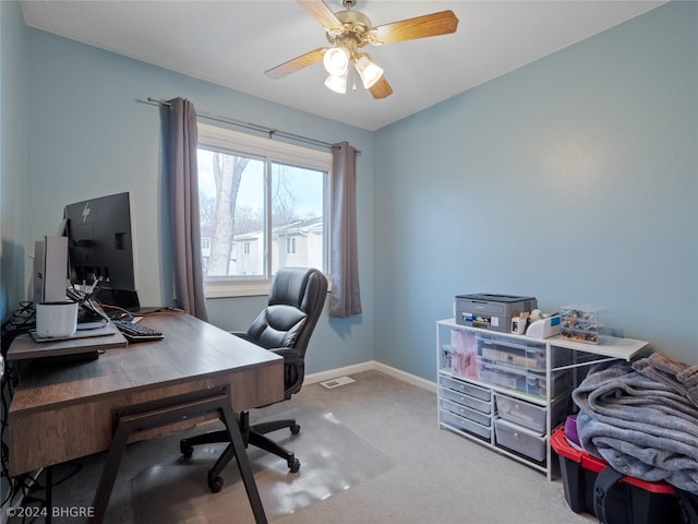 carpeted office with ceiling fan