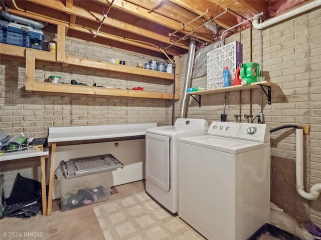 clothes washing area featuring washing machine and dryer