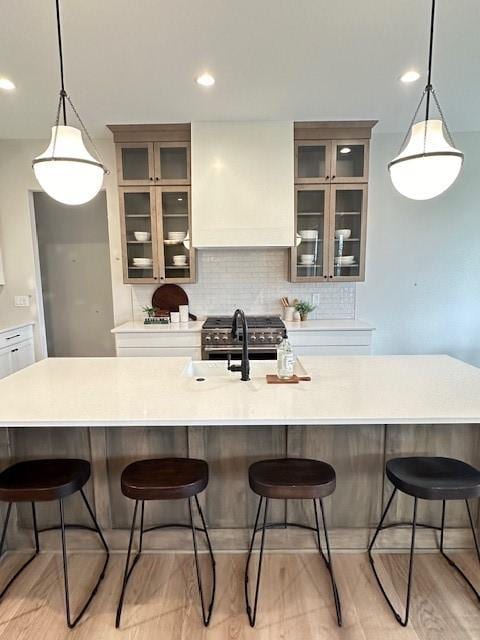 703 Richland Ct, Van Meter, IA 50261 - kitchen with tasteful backsplash, pendant lighting, light countertops, and a sink