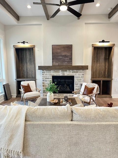 703 Richland Ct, Van Meter, IA 50261 - living room with beamed ceiling, ceiling fan, and wood finished floors