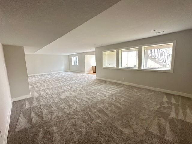 703 Richland Ct, Van Meter, IA 50261 - interior space with visible vents, carpet flooring, and baseboards