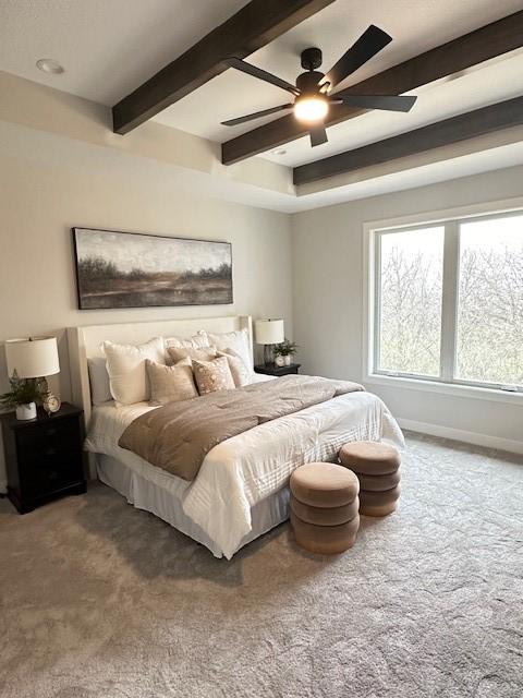 703 Richland Ct, Van Meter, IA 50261 - bedroom featuring beamed ceiling, carpet flooring, ceiling fan, and baseboards